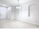 Bright living space with neutral tones and tile floors, highlighting recessed lighting and architectural details like niche shelving at 3000 Laurel Park Ln # 202, Kissimmee, FL 34741