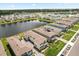 Enjoy neighborhood living with this aerial view highlighting a serene pond and manicured lawns at 3039 Meleto Blvd, New Smyrna Beach, FL 32168