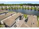 Lakeside homes with well-manicured lawns and landscaping in a quiet neighborhood from above at 3039 Meleto Blvd, New Smyrna Beach, FL 32168