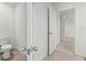 Bathroom with toilet, granite countertop, and door to bedroom at 3039 Meleto Blvd, New Smyrna Beach, FL 32168
