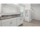 Bathroom showcasing double vanity, tile floor, and walk-in shower at 3039 Meleto Blvd, New Smyrna Beach, FL 32168