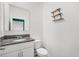 Bright bathroom featuring vanity, toilet, and granite countertops at 3039 Meleto Blvd, New Smyrna Beach, FL 32168