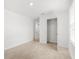 Bright and airy bedroom featuring an open closet with carpet floors at 3039 Meleto Blvd, New Smyrna Beach, FL 32168