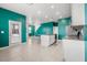 Open kitchen view with island, stainless steel appliances, and tiled floors at 3039 Meleto Blvd, New Smyrna Beach, FL 32168