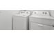 Bright laundry area features a Whirlpool washer and dryer for modern convenience at 3039 Meleto Blvd, New Smyrna Beach, FL 32168