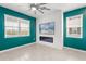 Contemporary living room with fireplace, TV, and natural light at 3039 Meleto Blvd, New Smyrna Beach, FL 32168