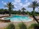 Resort-style pool area surrounded by palm trees and comfortable lounging spaces at 3039 Meleto Blvd, New Smyrna Beach, FL 32168