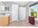 This bathroom has a large window, sink vanity, and a stand-up shower at 3063 Mandolin Dr, Kissimmee, FL 34744
