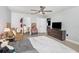 Spacious bedroom with a ceiling fan, tile floors, access to ensuite bath and walk-in closet at 3063 Mandolin Dr, Kissimmee, FL 34744
