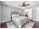 Bedroom with hardwood floors, ceiling fan, and ensuite bathroom at 3063 Mandolin Dr, Kissimmee, FL 34744
