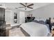 Comfortable bedroom featuring a ceiling fan, dark floors, and neutral gray walls at 3063 Mandolin Dr, Kissimmee, FL 34744