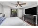 Bedroom featuring a ceiling fan, dresser, carpet and natural lighting at 3063 Mandolin Dr, Kissimmee, FL 34744