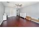 Spacious bedroom with hardwood floors, ceiling fan, double closets, and plenty of natural light at 3063 Mandolin Dr, Kissimmee, FL 34744