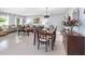 Dining area features tile floors, an inviting atmosphere, and an elegant chandelier, perfect for gatherings at 3063 Mandolin Dr, Kissimmee, FL 34744