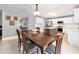 Dining area flows to the kitchen, featuring a wood table and chairs at 3063 Mandolin Dr, Kissimmee, FL 34744