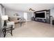 Spacious living room showcases tile floors, a ceiling fan, and a built-in entertainment center at 3063 Mandolin Dr, Kissimmee, FL 34744