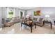 An inviting living room with tile floors, ample natural light, and stylish furnishings for a comfortable atmosphere at 3063 Mandolin Dr, Kissimmee, FL 34744