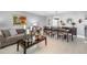Open-concept living and dining area featuring tile floors, stylish decor, and plenty of natural light at 3063 Mandolin Dr, Kissimmee, FL 34744