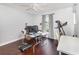 Home office with hardwood floors, a ceiling fan, and natural light at 3063 Mandolin Dr, Kissimmee, FL 34744