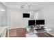 Home office with hardwood floors, multiple monitors, and white walls at 3063 Mandolin Dr, Kissimmee, FL 34744