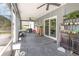 Enclosed back porch with ceiling fans, plenty of space, and views of the backyard at 3063 Mandolin Dr, Kissimmee, FL 34744