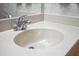 Close-up of a bathroom sink with a chrome faucet and a white countertop at 360 Pineview St, Altamonte Springs, FL 32701