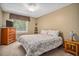 Neutral bedroom featuring carpeted floors, large windows, and simple decor for relaxation at 360 Pineview St, Altamonte Springs, FL 32701