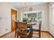 Cozy breakfast nook featuring a round table, wood chairs, and a large bay window for natural light at 360 Pineview St, Altamonte Springs, FL 32701