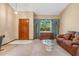 Inviting living room with large window, neutral color scheme, and cozy furniture at 360 Pineview St, Altamonte Springs, FL 32701