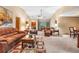 Large living room with neutral carpet, plentiful furniture, and soaring ceilings at 360 Pineview St, Altamonte Springs, FL 32701