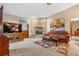 Cozy living room featuring a stone fireplace and comfortable seating at 360 Pineview St, Altamonte Springs, FL 32701