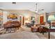 Open living room with vaulted ceilings, comfortable seating, and natural light at 360 Pineview St, Altamonte Springs, FL 32701