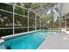 Sparkling blue pool enclosed with screened-in lanai offers a refreshing outdoor retreat at 360 Pineview St, Altamonte Springs, FL 32701