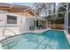 Sparkling pool with screened enclosure and patio furniture perfect for relaxation and outdoor entertaining at 360 Pineview St, Altamonte Springs, FL 32701
