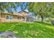 Well-maintained backyard with a screened patio and lush green grass at 369 Torgiano Dr, Ocoee, FL 34761