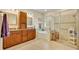 Bathroom with double sinks, soaking tub, and separate shower with glass enclosure at 369 Torgiano Dr, Ocoee, FL 34761