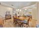 Open dining room with wood table, chairs, and seamless transition to other living areas at 369 Torgiano Dr, Ocoee, FL 34761