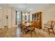 Comfortable dining room with large windows and wood table, creating a perfect setting for meals at 369 Torgiano Dr, Ocoee, FL 34761