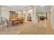 Spacious dining room featuring a wooden table set and views into the living room at 369 Torgiano Dr, Ocoee, FL 34761