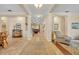 Inviting foyer with tile floors, decorative columns, and a view into the living spaces at 369 Torgiano Dr, Ocoee, FL 34761