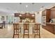Spacious kitchen featuring a center island and stainless steel appliances at 369 Torgiano Dr, Ocoee, FL 34761