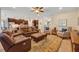 Comfortable living room with a ceiling fan seamlessly connects to the kitchen at 369 Torgiano Dr, Ocoee, FL 34761