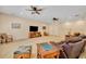 Open living room with comfortable leather seating and a TV console at 369 Torgiano Dr, Ocoee, FL 34761