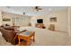 Expansive living room featuring plush seating, a large TV, and ample natural light at 369 Torgiano Dr, Ocoee, FL 34761