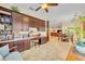 Built-in office space with desk, cabinets, and a view of the dining and living area at 369 Torgiano Dr, Ocoee, FL 34761