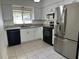 Modern kitchen features sleek, stainless steel appliances, granite countertops, and ample cabinet space at 3739 S Fern Creek Ave, Orlando, FL 32806