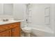 Clean bathroom with a shower-tub combo and wood vanity at 384 Zinnia Dr, Casselberry, FL 32707