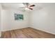 Bedroom featuring laminate floors, a ceiling fan, and neutral walls at 384 Zinnia Dr, Casselberry, FL 32707