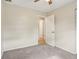 Neutral bedroom featuring carpet, a ceiling fan, and a door leading to ensuite bathroom at 384 Zinnia Dr, Casselberry, FL 32707