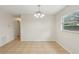 Bright dining area with tile flooring, natural light, and contemporary light fixture at 384 Zinnia Dr, Casselberry, FL 32707
